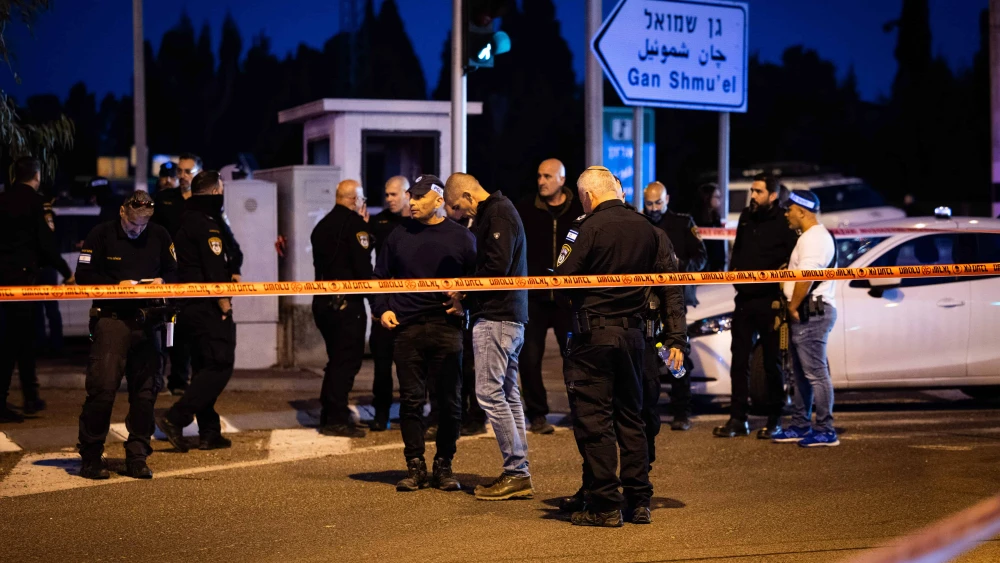 Police at the scene of a terrorist car-ramming attack at the Karkur Junction, Feb. 27, 2025. Photo by Itay Cohen/Flash90.