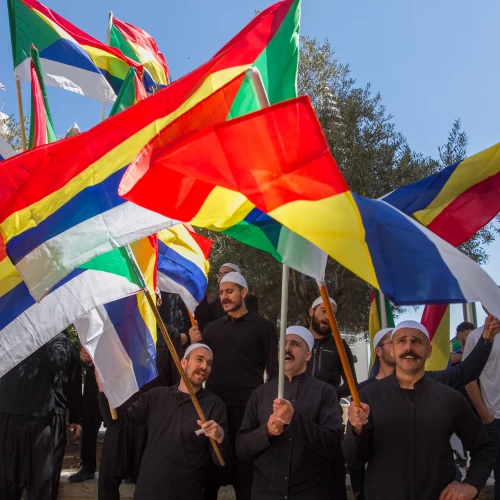 Druze men protest outside the Hafia District Court, carrying both the Druze and the Israeli flags. Photo by Flash90.