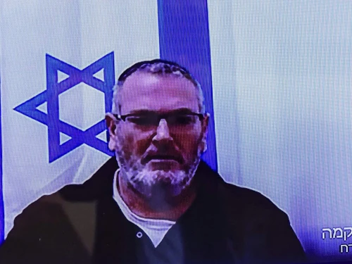 Bezalel Zini appears on a screen at Beersheva District Court ahead of the filing of an indictment against him, on Feb. 5, 2026. Photo by Tsafrir Abayov/Flash90.