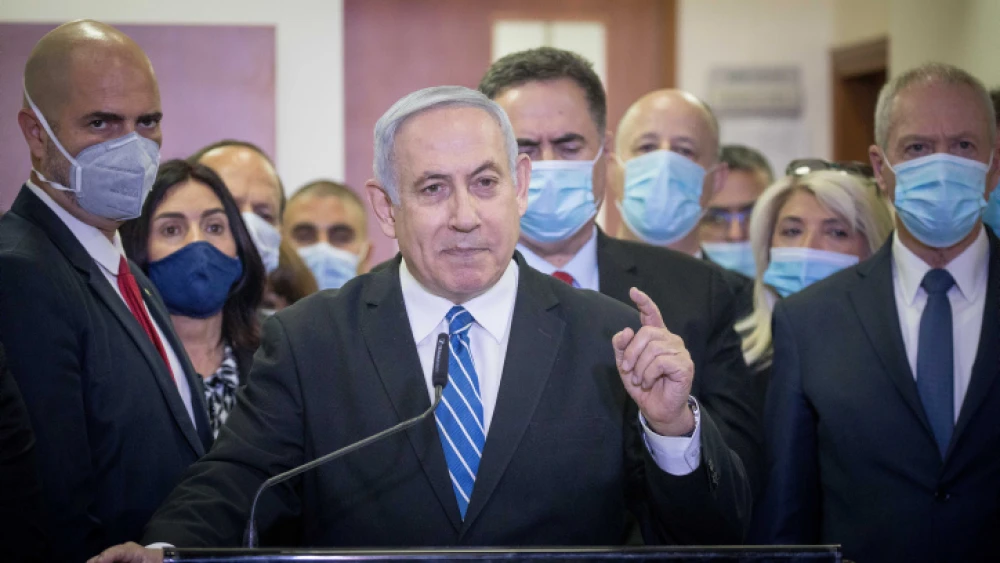 Israeli Prime Minister Benjamin Netanyahu is surrounded by Likud lawmakers as he gives a press statement ahead of the start of his trial at the District Court in Jerusalem. May 24, 2020. Photo by Yonatan Sindel/Flash90.