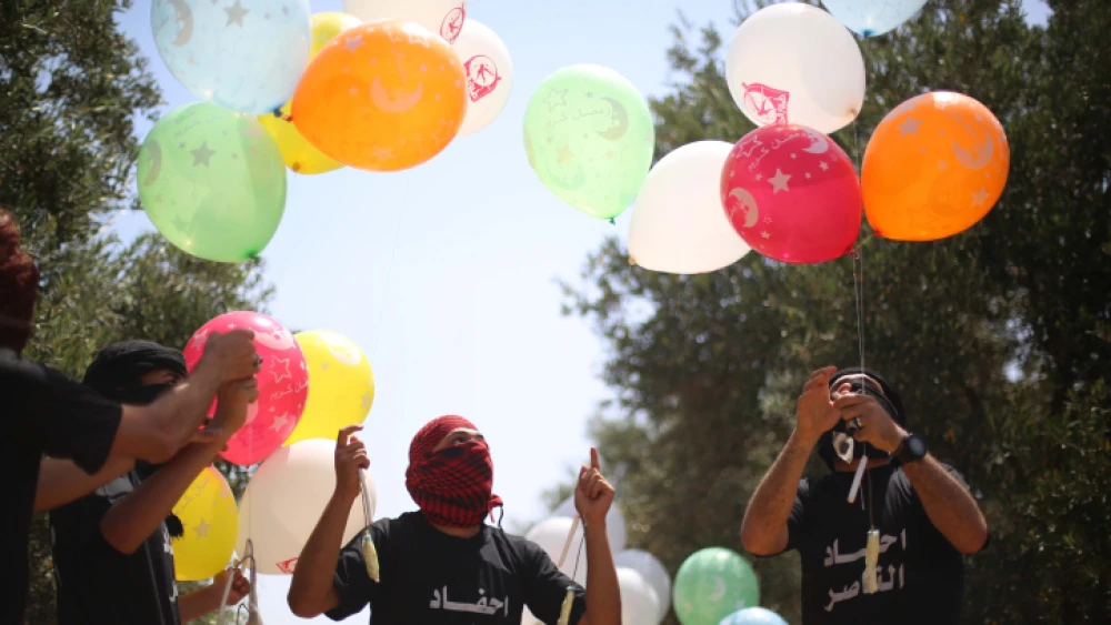 Palestinian youths in the Gaza Strip prepare incendiary balloons with which to attack Israel, May 31, 2019. Photo by Hassan Jedi/Flash90.