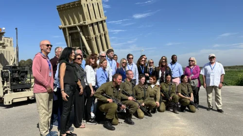 U.S. lawmakers pose with an Iron Dome battery while touring Israel. February 2022. Credit: AIPAC/Twitter.