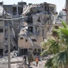 Rescue teams inspect the damage to buildings struck by an Iranian ballistic missile in central Israel, June 19, 2025. Photo by Gili Yaari/Flash90.