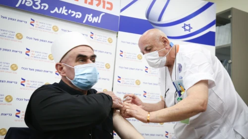 Heads of different religious communities in Israel get a COVID-19 vaccine at the Ziv Hospital in Tzfat, Dec. 24, 2020. Photo by David Cohen/Flash90.