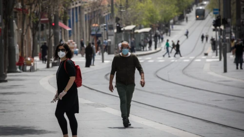 People walk on Jaffa Street in downtown Jerusalem on April 19, 2020. Photo by Nati Shohat/Flash90.