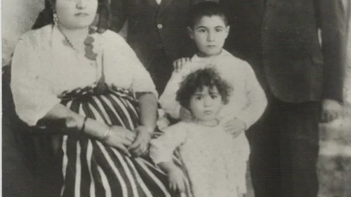 Click photo to download. Caption: Prof. Maurice Roumani's grandparents and other family members from Libya, pictured in the late 1920s. Members of Roumani's extended family in Libya endured everything from expulsions, to a 1,200-mile trek through the Saharan desert, to deportations to the Bergen-Belsen concentration camp. Credit: Courtesy Prof. Maurice Roumani.