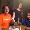 Solar-power pioneer Yosef Abramowitz (left) pictured with two of his five children, Ashira and Zamir, as the family uses its bicycle-shaped Hanukkah menorah. Credit: Courtesy Yosef Abramowitz.