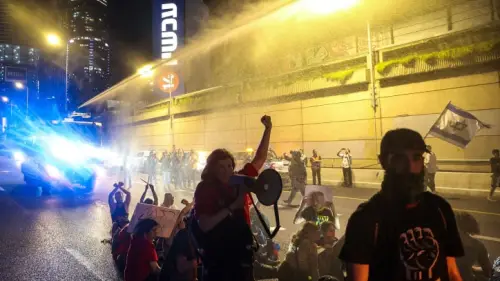 Police use a water cannon to disperse demonstrators blocking the Ayalon Highway in Tel Aviv, March 30, 2024. Photo by Itai Ron/Flash90.