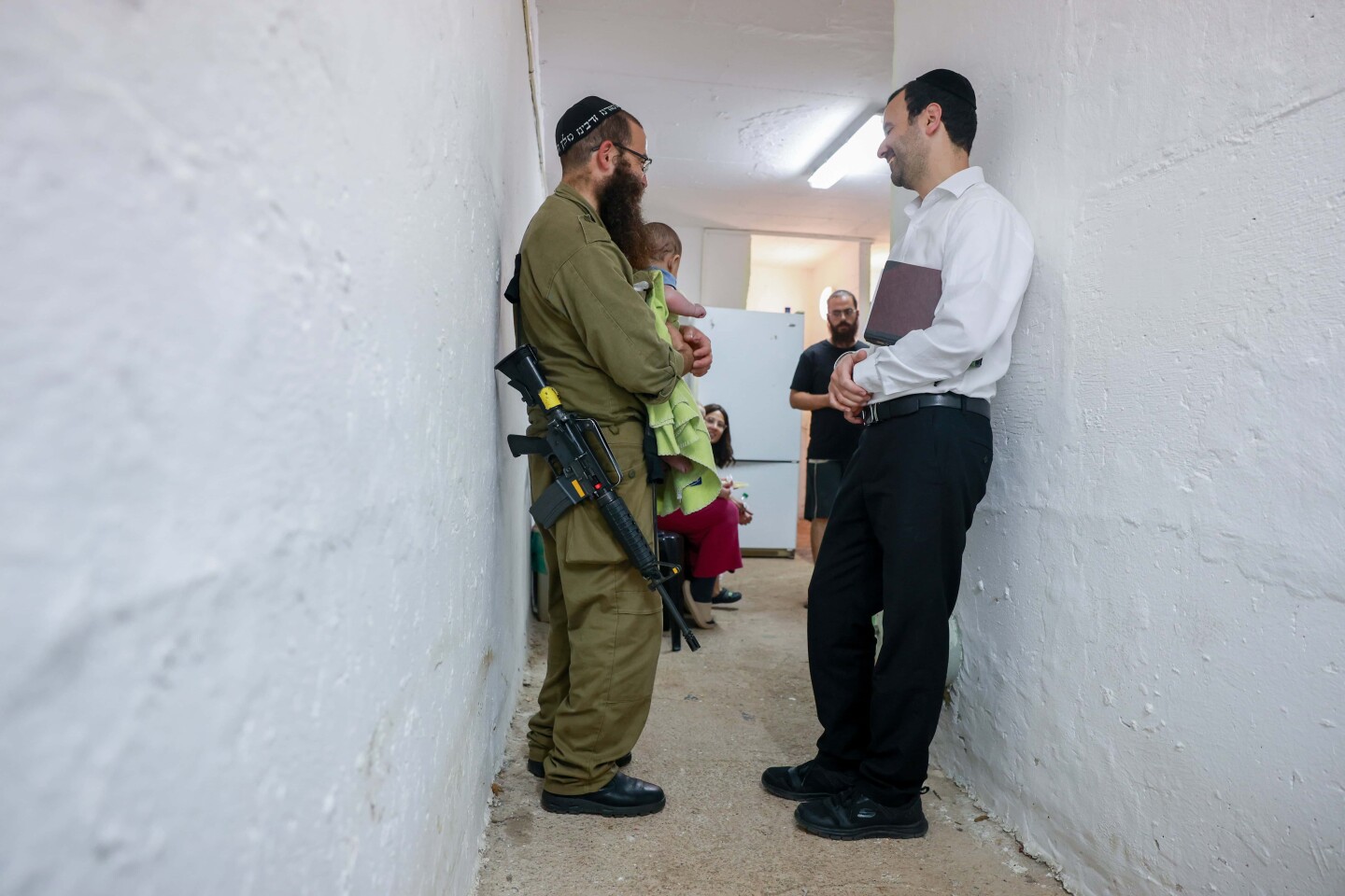 Ultra-Orthodox Jews pray inside a public shelter in northern Israel during alarms and rocket and missile fire from Iran into Israel. June 16, 2025. Photo by David Cohen/FLASH90.