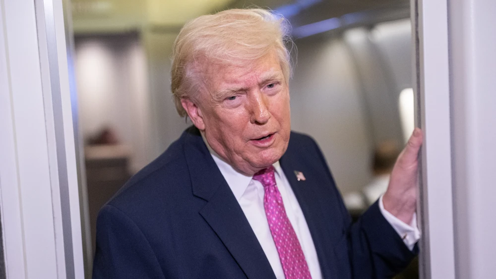 U.S. President Donald Trump speaks with members of the media onboard Air Force One on March 29, 2026 while en route to Joint Base Andrews, Maryland from West Palm Beach Florida. President Trump returned to Washington D.C. on Sunday following a weekend trip to Florida. Photo by Nathan Howard/Getty Images.
