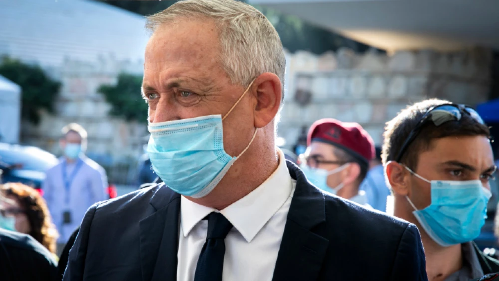 Israeli Defense Minister Benny Gantz pays a visit to Leah and Simcha Goldin, parents of fallen IDF soldier Lt. Hadar Goldin, as they attend a passive protest outside the military cemetery in Jerusalem on July 2, 2020. Photo by Olivier Fitoussi/Flash90.