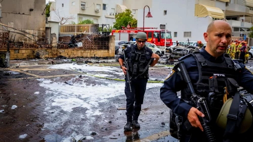 Israeli security and rescue forces at the scene where a rocket fired from the Gaza Strip hit buildings and cars in the southern Israeli city of Ashdod, Oct. 9, 2023. Credit: Liron Moldovan/Flash90.