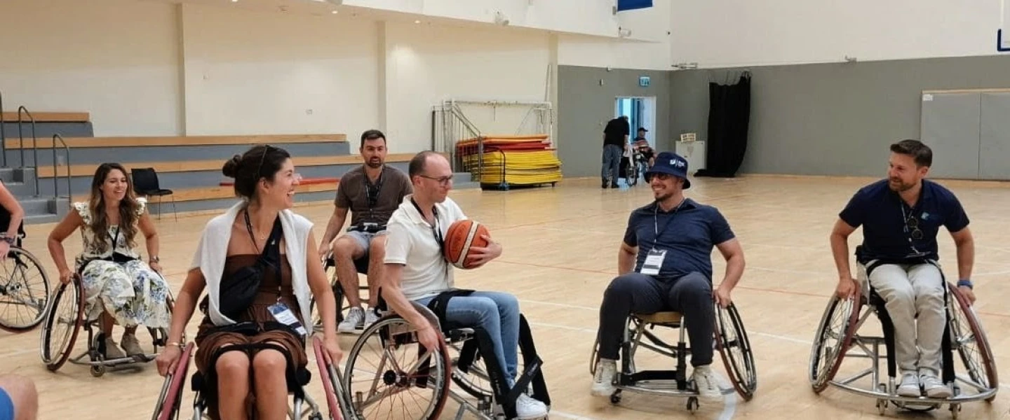 Participants playing wheelchair basketball at ADI Negev