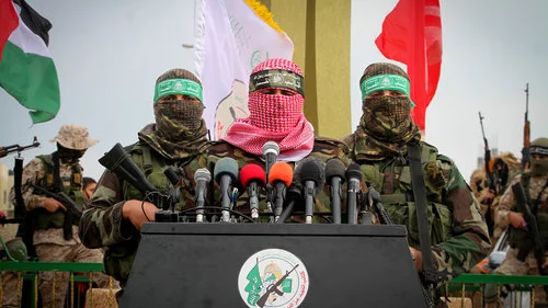 Abu Ubaida (center), a spokesman for Hamas’s “military wing,” speaks in the southern Gaza town of Rafah on Jan. 31, 2017. Credit: Abed Rahim Khatib/Flash90.