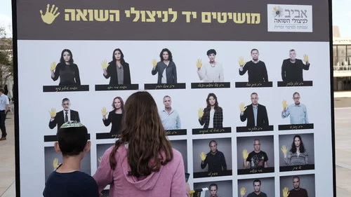 On Yom Hashoah April 23, 2017, Israeli youths visit a display in Tel Aviv that raises awareness about the living conditions of Holocaust survivors in Israel. Credit: Tomer Neuberg/Flash90.