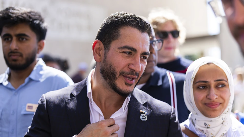 Michigan Democratic Senate primary winner Abdul El-Sayed arrives with his wife, Sarah Jukaku, at a press conference in front of the Spirit of Detroit statue in Detroit on Aug. 5, 2026. He faces former Republican Rep. Mike Rogers in November. Photo by Finn Gomez/Getty Images.