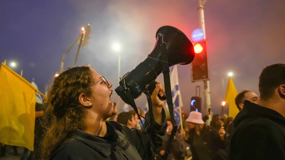 Israelis protest against the Israeli government and for the release of Israelis held hostage in the Gaza Strip, at the Goma junction, northern Israel, on Jan. 11, 2025. Photo by Ayal Margolin/Flash90.