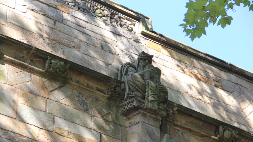 Sterling Memorial Library at Yale University in New Haven, Conn., with a statue of Moses with horns protruding from his head. Photo by Karyn Bell.