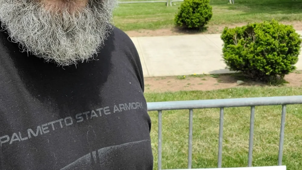 Luke Moon protesting a pro-Palestinian rally.