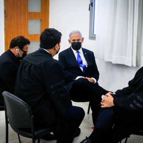 Israeli Prime Minister Benjamin confers with his legal staff at the District Court in Jerusalem on April 5, 2021. Photo by Oren Ben Hakoon/POOL.