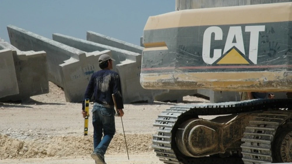A Caterpillar bulldozer amid construction of the Israel's West Bank security fence. The Presbyterian Church (USA) General Assembly in July 2012 voted 333-331 against a resolution to divest from Caterpillar, Hewlett-Packard, and Motorola Solutions over those companies’ profit “from non-peaceful pursuits in Israel-Palestine.” Now, the Presbyterian Church's new study guide on the Arab-Israeli conflict has been accused of being a “hateful document” that “promotes the eradication of Israel.” Credit: Justin McIntosh via Wikimedia Commons.