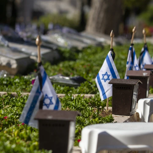 Israeli flags placed by each grave in the military cemetery of Netanya, ahead of the Israel's Memorial Day for fallen soldiers and victims of terror, on May 7, 2019. Photo by Flash90.