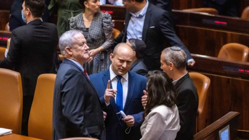 Yamina Party head Naftali Bennett (center), Blue and White Party leader Benny Gantz (left), Yamina MK Ayelet Shaked (bottom right) and Blue and White MK Hilik Tropper in the plenum hall of the Israeli parliament during the voting in the presidential elections, in Jerusalem, June 2, 2021. Photo by Olivier Fitoussi/Flash90.