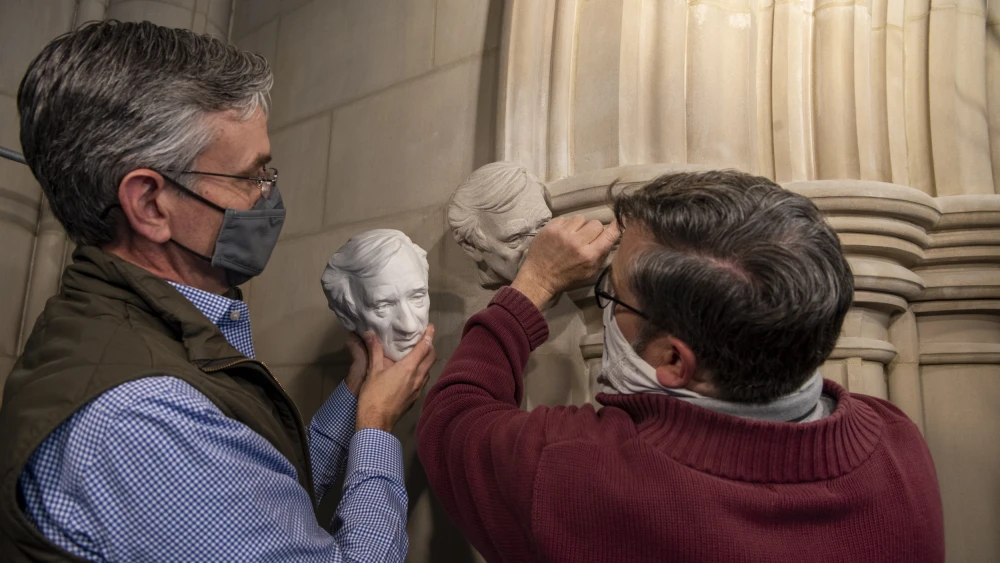 Workers erect the bust of Elie Wiesel at the National Cathedral in Washington, D.C. Credit: Courtesy.