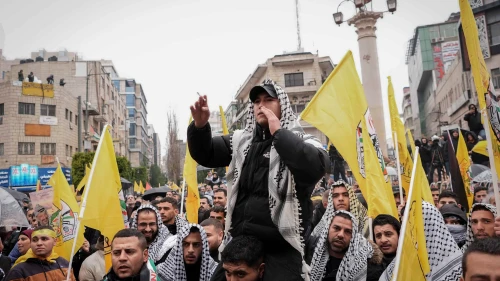 Fatah supporters gather for a rally ahead of the 60th anniversary of its establishment in Ramallah, Samaria