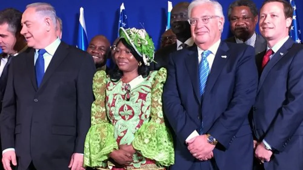 In front, Israeli Prime Minister Benjamin Netanyahu (left), U.S. Ambassador to Israel David Friedman (third from left) and Power Africa initiative Coordinator Andrew Herscowitz (right) attend the Dec. 4 signing of a memorandum of understanding on Israel's entrance into Power Africa. Credit: Alex Traiman.
