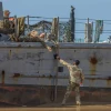 U.S. military personnel at a U.S. Army vessel that washed up on the beach in Ashdod, May 25, 2024. Photo by Liron Moldovan/Flash90.