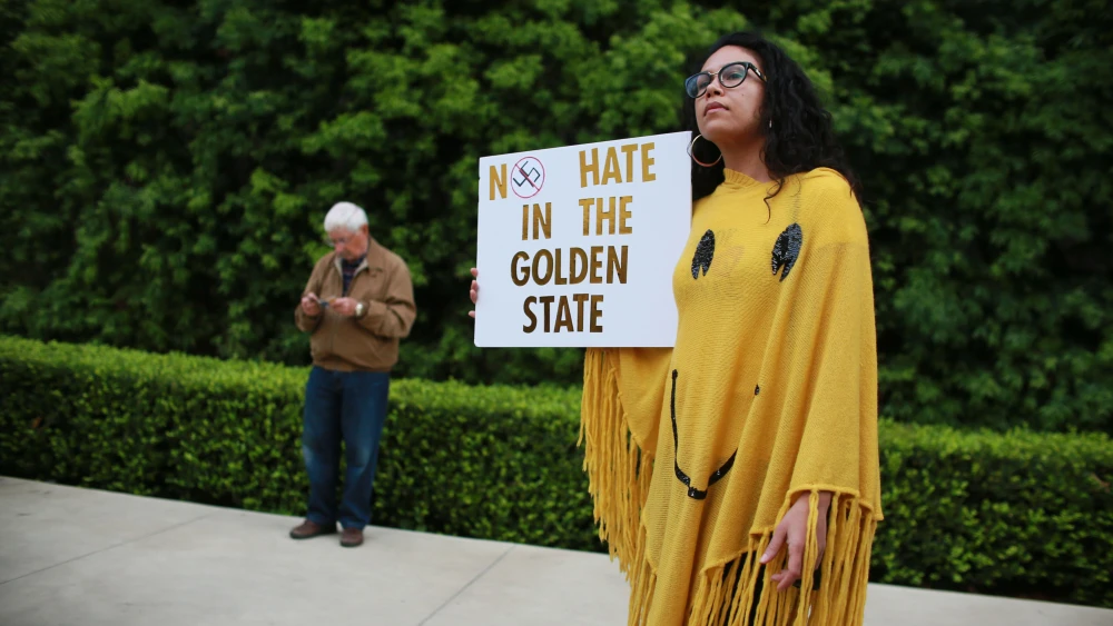 Demonstrators during a rally in San Diego, held on the eve of U.S. President Donald Trump's visit to California, where he will be viewing prototypes of a border wall between Mexico and the United States, March 12, 2018. Photo by Sandy Huffaker/Getty Images.