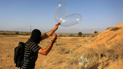 Palestinians prepare a balloon that will be attached to flammable materials to be flown towards Israel near the Israeli Gaza border, in Rafah in the southern Gaza Strip on June 17, 2018. Photo by Abed Rahim Khatib/Flash90.