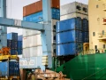 Workers unload shipping containers at Ashdod Port on Israel's southern coast on April 5, 2020. Photo by Flash90.