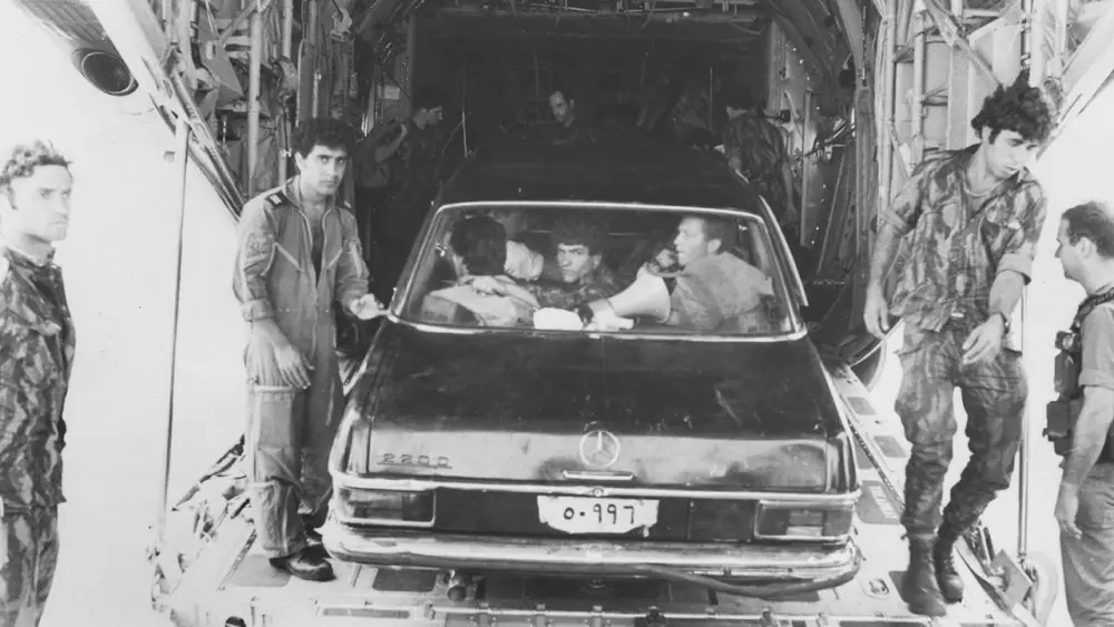 Sayeret Matkal commandos pose with the black Mercedes they used to deceive Ugandan troops during the hostage rescue at Entebbe Airport on July 4, 1976. Credit: IDF Spokesperson.