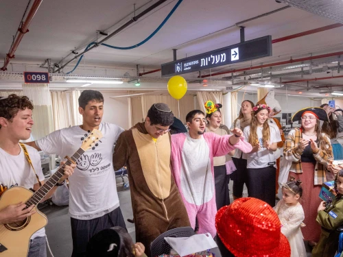 Celebrating Purim in an underground parking area converted to a treatment ward at Shaarei Tzedek Medical Center in Jerusalem, March 4, 2026. Photo by Chaim Goldberg/Flash90.