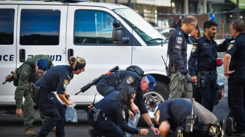 Security personnel at the scene of a drone attack in Tel Aviv, July 19, 2024. Photo by Avshalom Sassoni/Flash90.