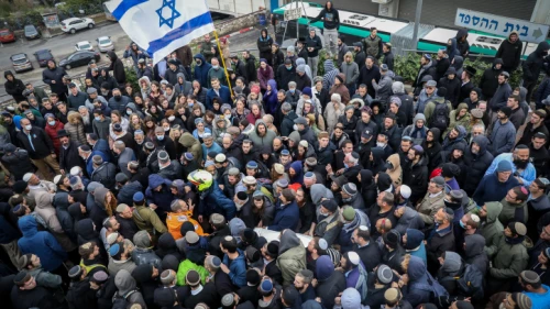 Family and friends attend the funeral of Yehuda Dimentman at Har HaMenuchot Cemetery in Jerusalem, on Dec. 17, 2021. Photo by Noam Revkin Fenton/Flash90.