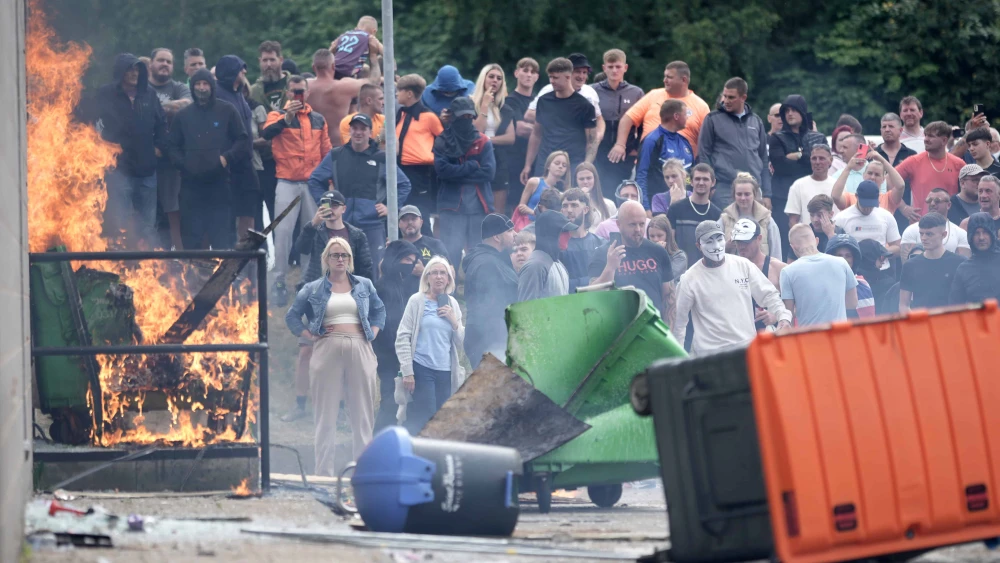 Anti-immigration protesters are seen during riots outside of the Holiday Inn Express in Manvers, which is being used as an asylum hotel, on Aug. 4, 2024 in Rotherham, United Kingdom. Photo by Christopher Furlong/Getty Images.
