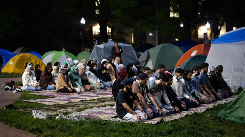 Students pray at the Gaza solidarity encampment at George Washington University, in its 12th day, Washington, D.C., on May 6, 2024. Photo by Allison Bailey/Middle East Images/AFP via Getty Images.