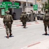 Israeli troops arrest a Palestinian terrorist in Awarta, near Nablus (Shechem) in central Samaria, May 16, 2024. Credit: IDF.