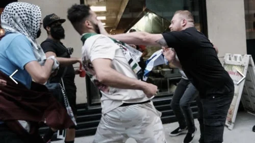 Snir Dayan and Amit Skornik defending themselves after being attacked by pro-Palestinian protesters in New York City, May 2021. Source: Screenshot.