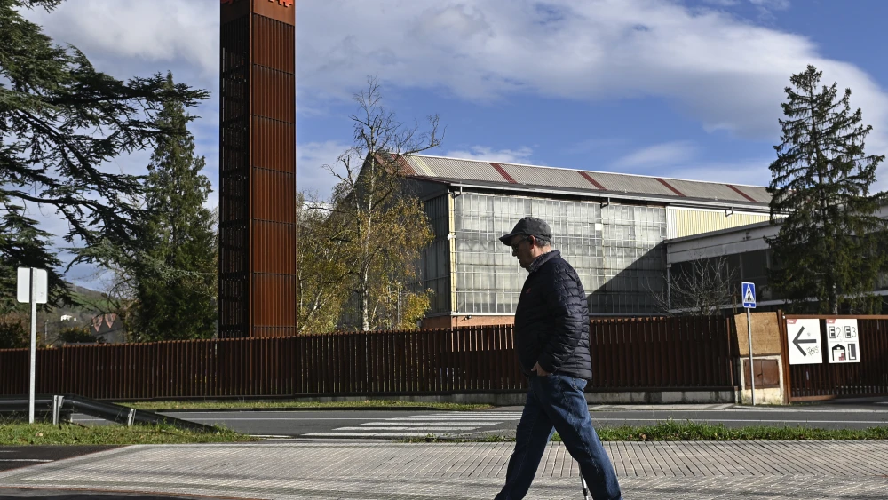 A man walks outside the headquarters of Spanish multinational train manufacturer CAF in Beasain, Spain, on Dec. 20, 2025. Photo by Ander Gillenea/AFP via Getty Images.