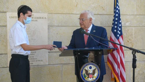 U.S. Ambassador to Israel David Friedman hands the first U.S. passport with “Israel” listed to Jerusalem-born American citizen Menachem Zivotofsky at the U.S. embassy in Jerusalem on Oct. 30, 2020. Source: David M. Friedman/Twitter.