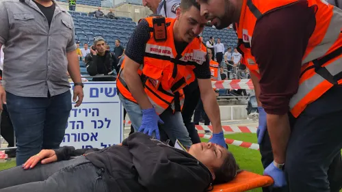 United Hatzalah emergency personnel treating a patient at a mass-casualty simulation at Teddy Stadium in Jerusalem. Photo by Eliana Rudee.