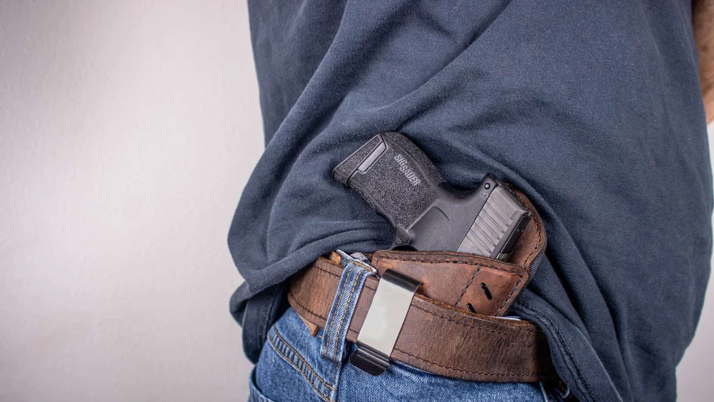Man With Gun in Belt