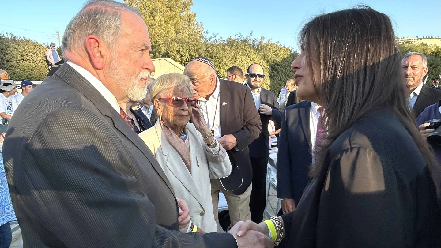 US Ambassador Mike Huckabee greets Jewish National Fund-USA Israel Director Tali Tzour Avner at the 9/11 memorial ceremony in Jerusalem, September 11, 2025. Photo by Judy Lash Balint.