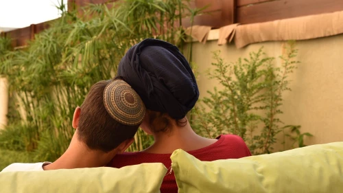 One of the house mothers and a child at the Neve Michael children's home in Israel. Photo by Chanan Nachmani.
