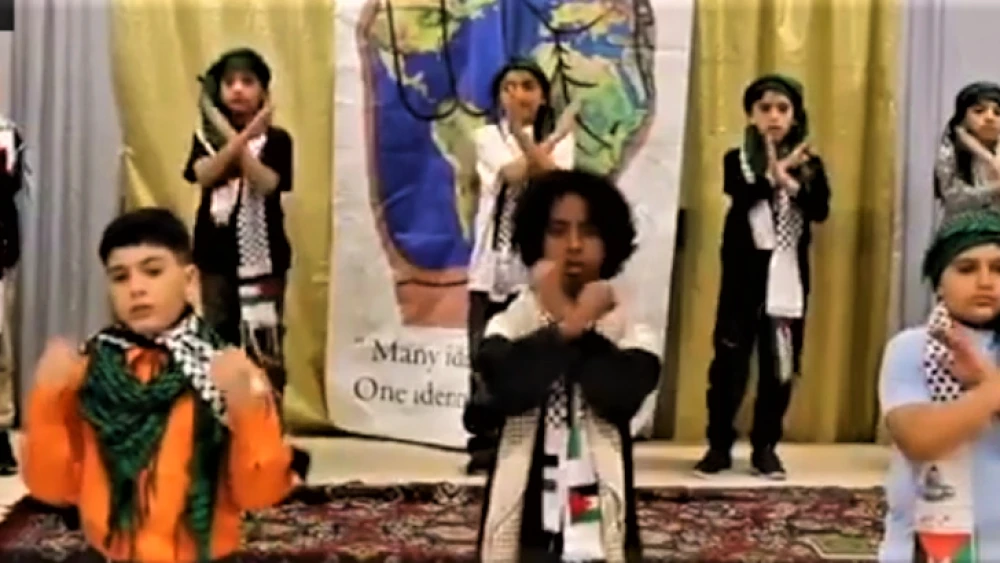 A still shot from a video posted on Facebook by the Muslim American Society Islamic Center in Philadelphia showing young children wearing Palestinian scarves while singing and reading poetry about killing for Allah and the Al-Aqsa mosque. in Jerusalem. Source: Screenshot.