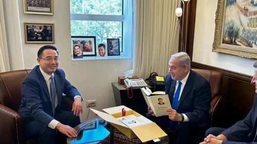 Prime Minister Benjamin Netanyahu holds an autographed copy of Chinese President Xi Jinping's book that Ambassador Cai Run gave him during their meeting in Jerusalem, July 26, 2023. Credit: Prime Minister's Office.